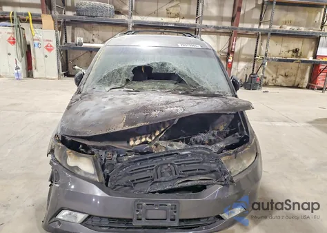 2012 Honda Odyssey Touring z USA, uszkodzony, nr VIN 5FNRL5H97CB014305